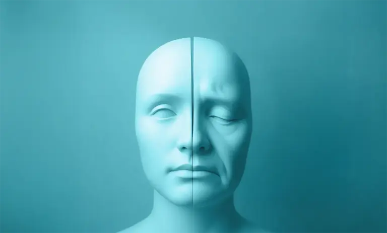 Fazialisparese - hier sieht man eine Grafik von einem Gesicht, das in der Mitte gespalten ist: eine Hälfte ist gesund, die andere Seite ist gelähmt.